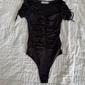 ADIKA Black Size XS short sleeve bodysuit with snap bottom and ruching